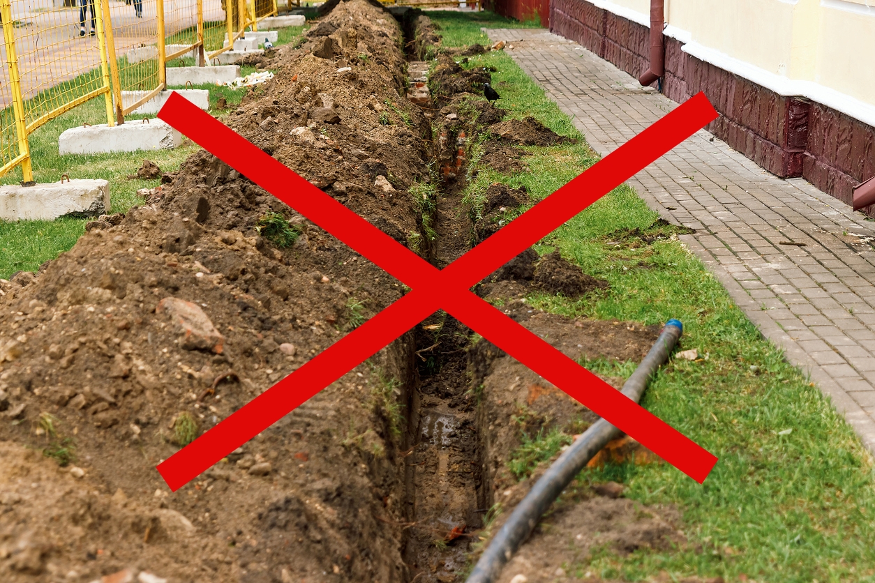 Trenchless is better. Long plumbing trench destroys grass