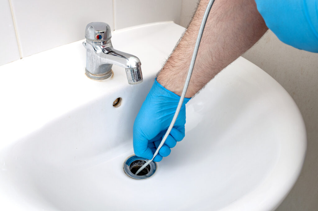 Plumber video inspecting a bathroom sink